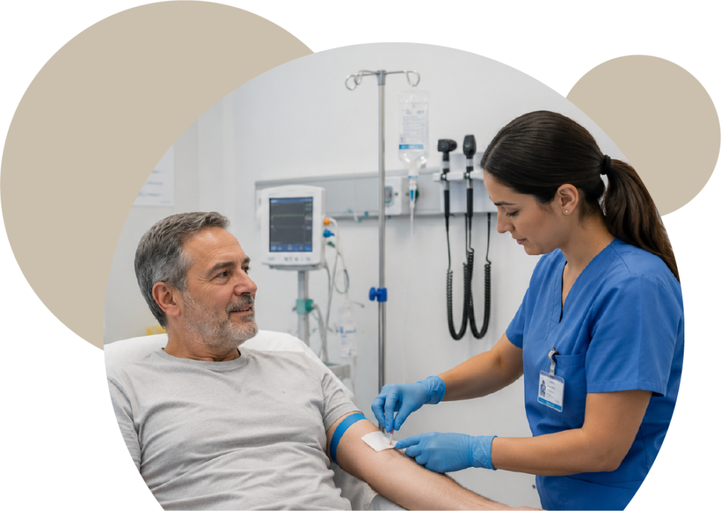 A clinical professional in blue scrubs and gloves attending to a senior male patient in a medical room, preparing for a blood draw or intravenous procedure at Posada Vida Health foundation.
